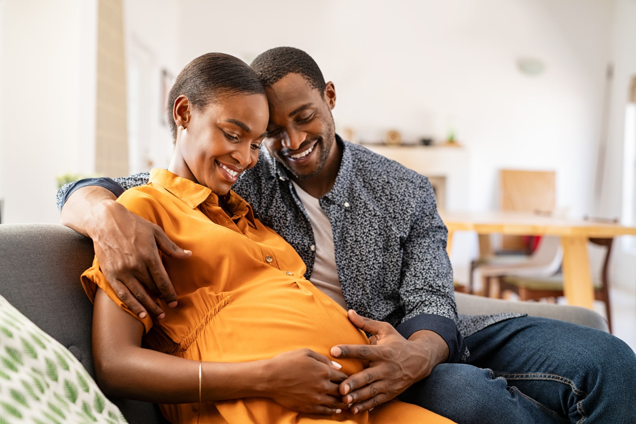 Happy man with pregnant partner.